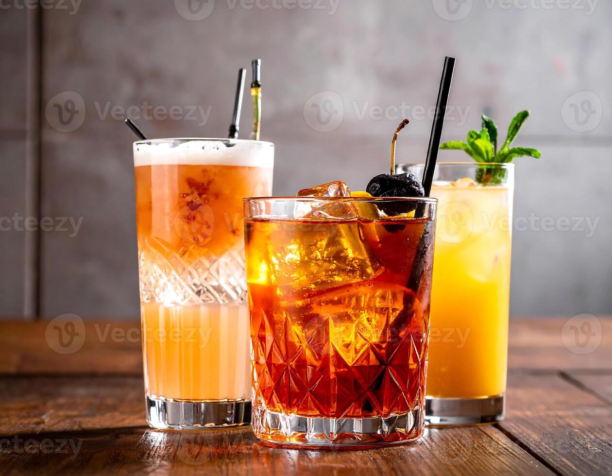 Bartender preparing cocktails with orange juice and ice on wooden table photo