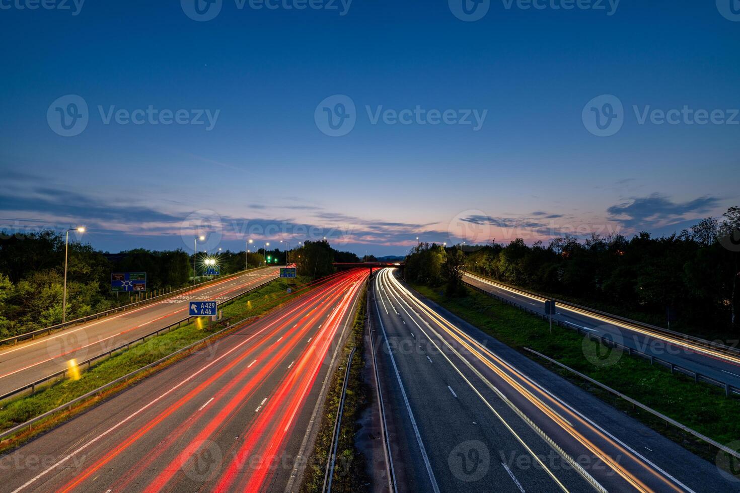 Light trails illuminating the m40 motorway at dusk, United Kingdom photo