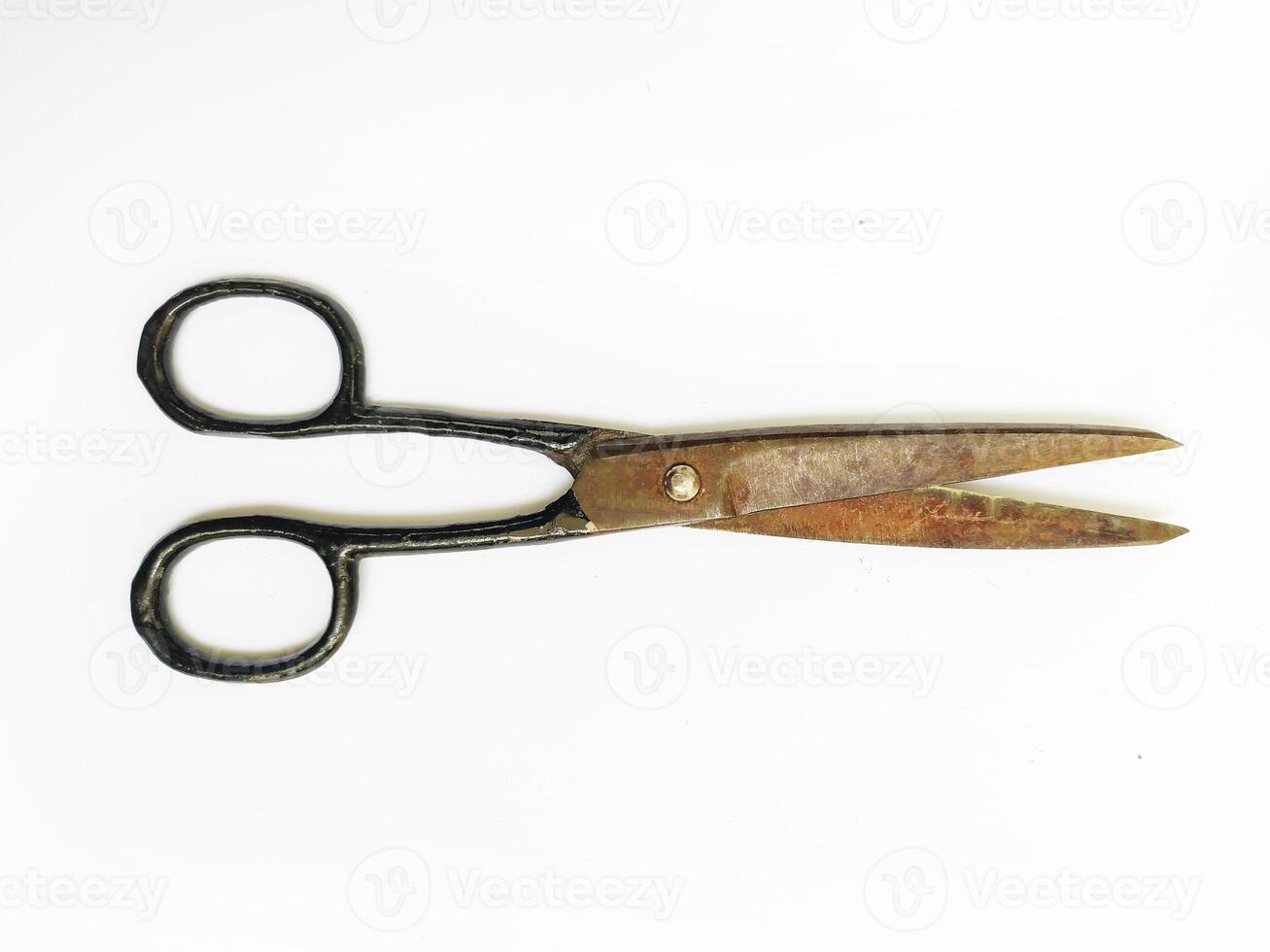 Antique scissors on white background. A weathered, rustic tool suggesting themes of time, craftsmanship, and the passage of years. Perfect for vintage, historical, or DIY projects. photo