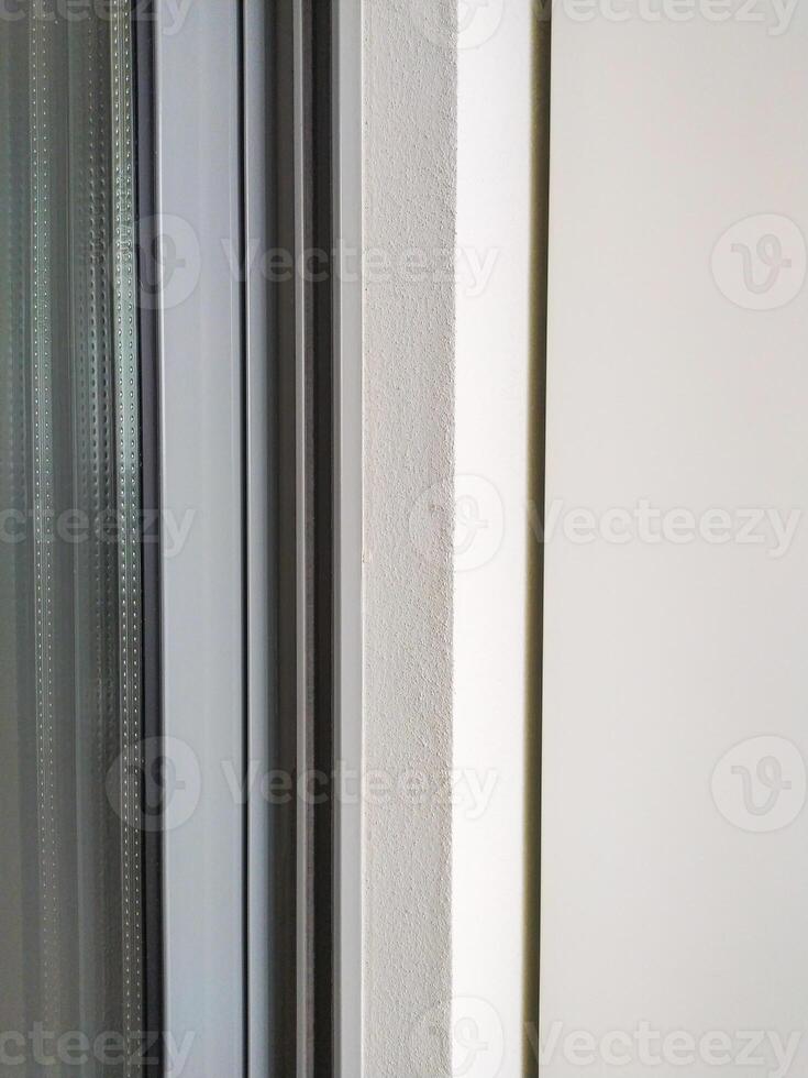 Modern, minimalist architectural detail featuring clean lines and textures. Ideal for backgrounds, design elements, or illustrating precision and simplicity. photo