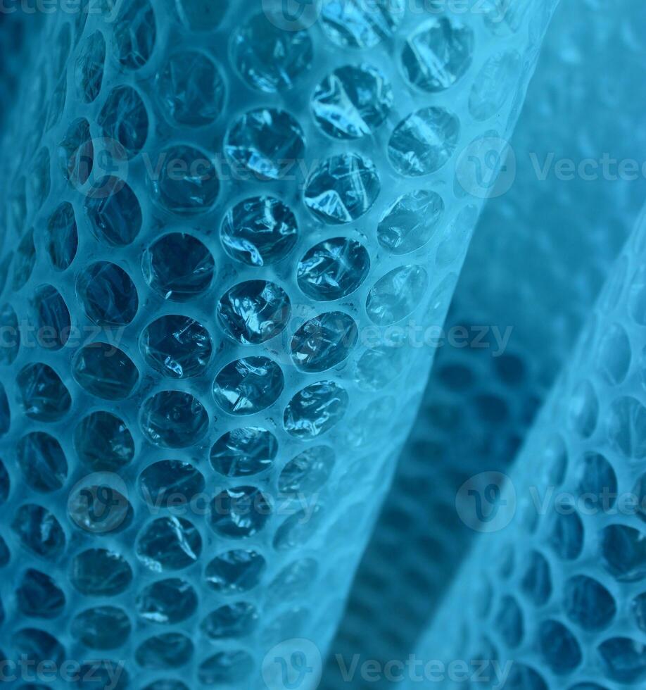 Rows Of Round Extruded Elements On Elastic Bent Structure. Abstract 3D Background With Blue Mesh Texture photo