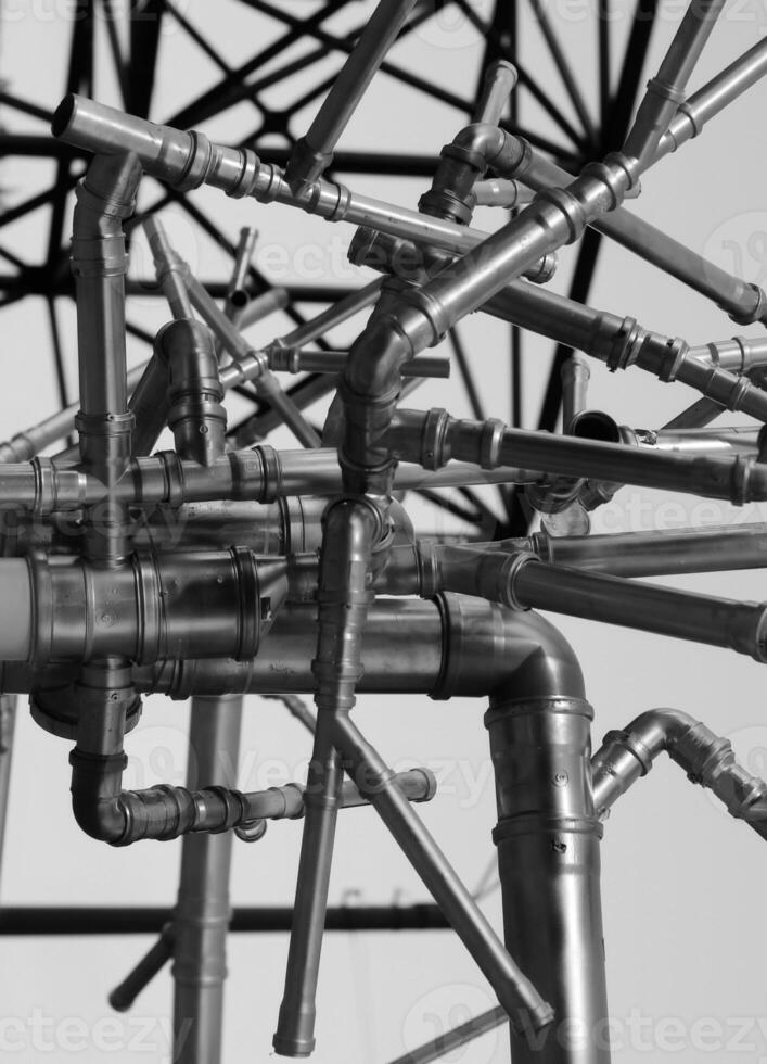 Dark Iron Pipe Network Chaotic Structure. Stock Photo For Pipe Transport Illustration