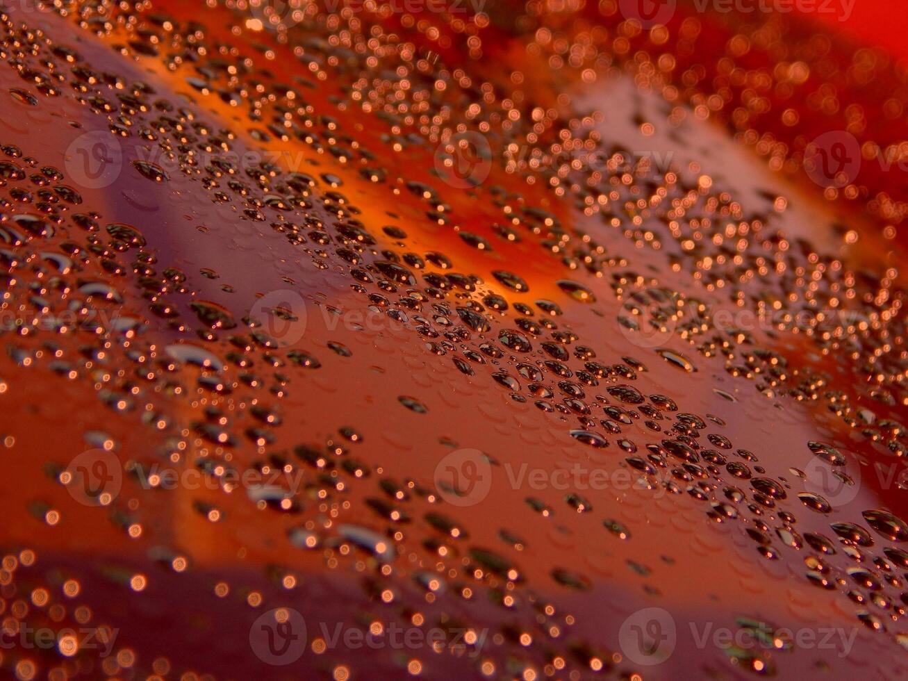 Abstract Pattern Of Liquid Drops On Glass Surface With Colored Backlight photo