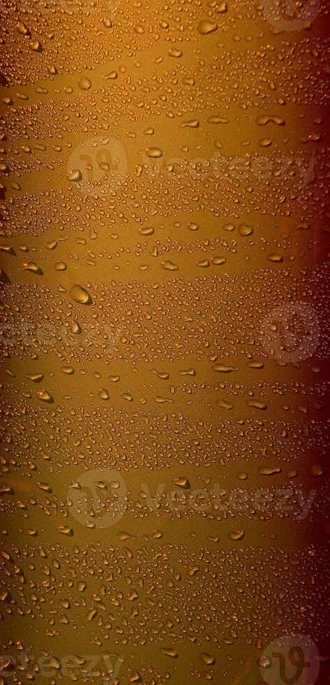 Pattern of variety size drops on golden glossy surface. Stock Photo For Abstract Golden Vertical Backgrounds