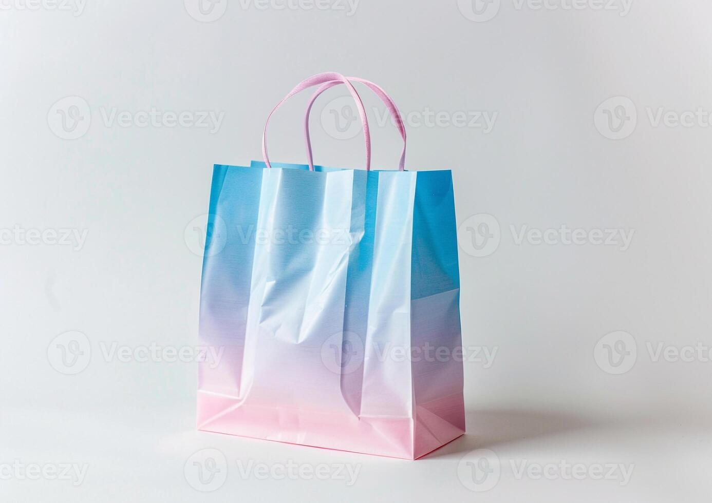 A pastel paper bag with soft pink and blue gradients, radiating charm, sweetness, and stylish simplicity. photo