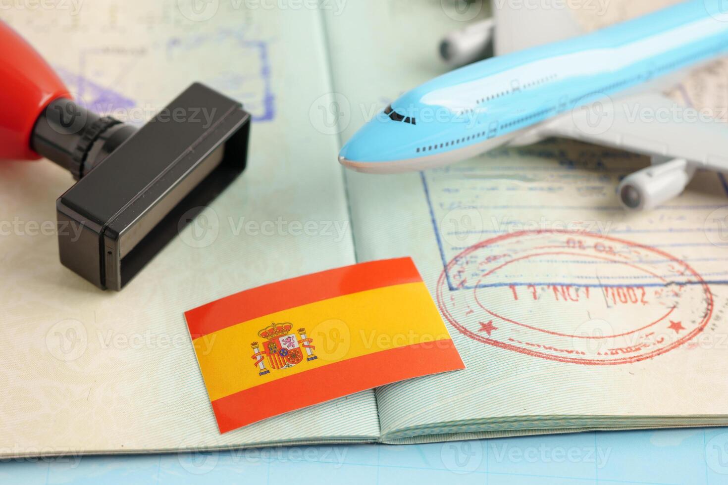 Spain passport with approved stamp on document for tourism. photo