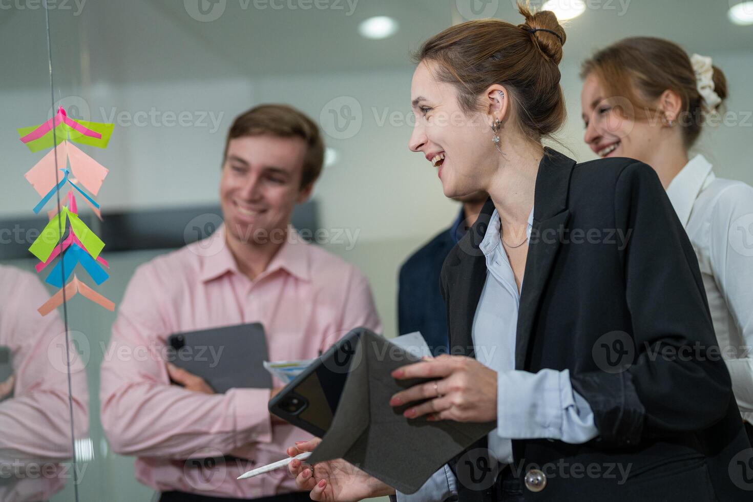 Team collaboration during a brainstorming session in a modern office setting in the afternoon photo