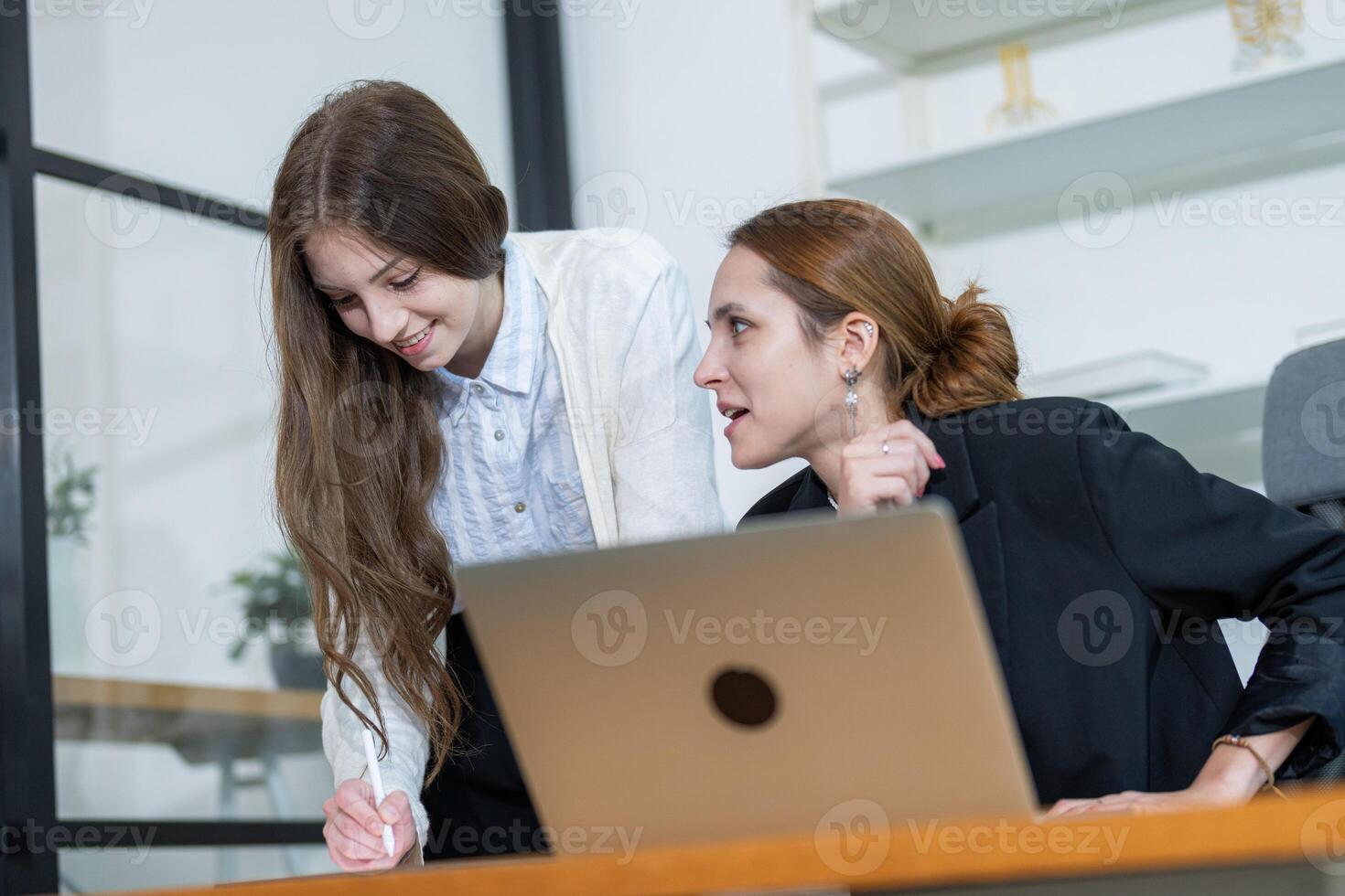 Colleagues collaborating in modern office environment focused on project discussion and brainstorming session photo