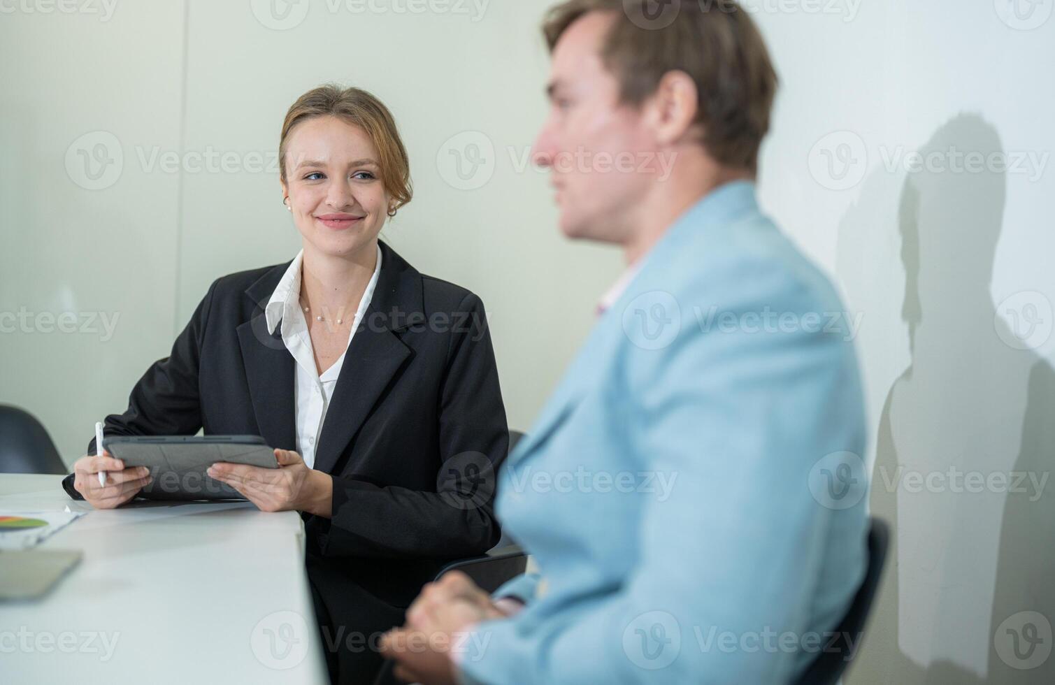 Engaging conversation during a business meeting in a modern office environment photo