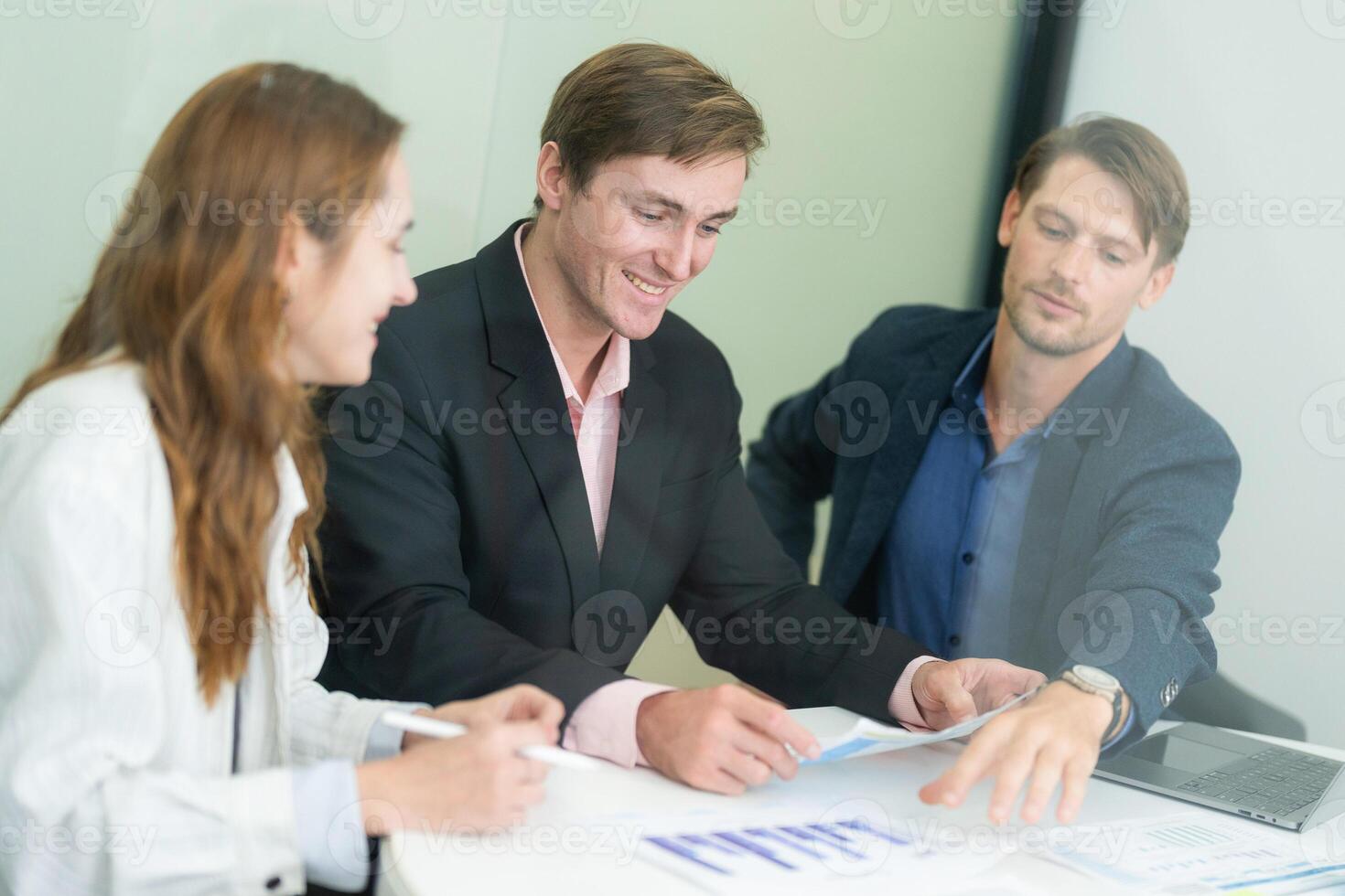 Professionals collaborate in a modern office environment during a business meeting focused on project planning and strategy development photo