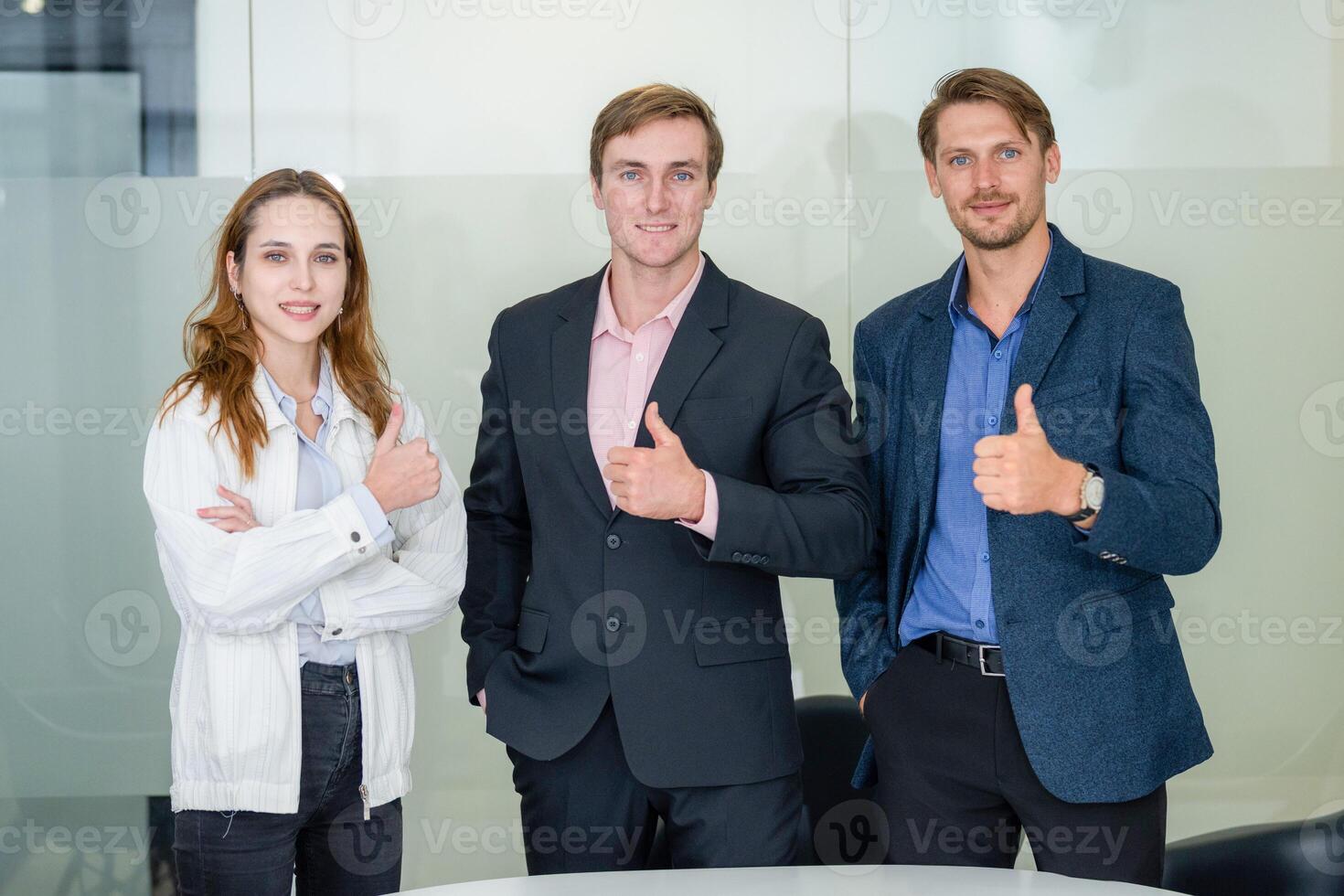 Team members celebrate success in a modern office setting during a business meeting photo