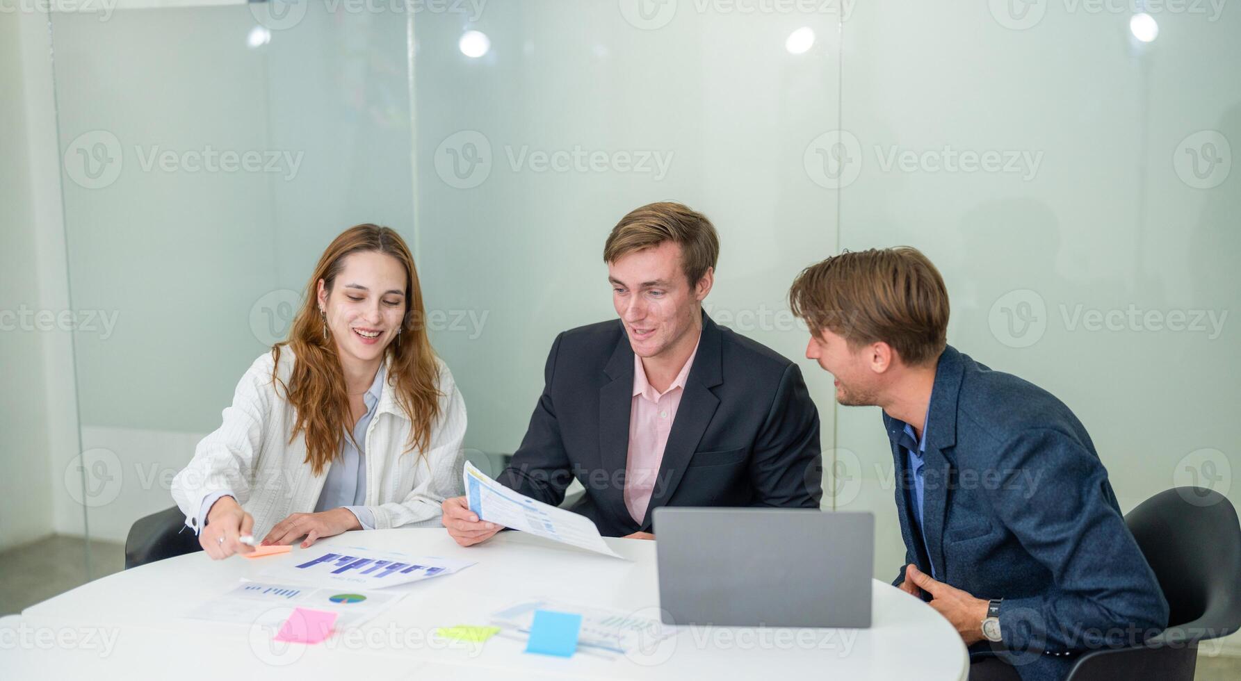 Professionals collaborating in a modern office setting for a project discussion and strategy planning photo
