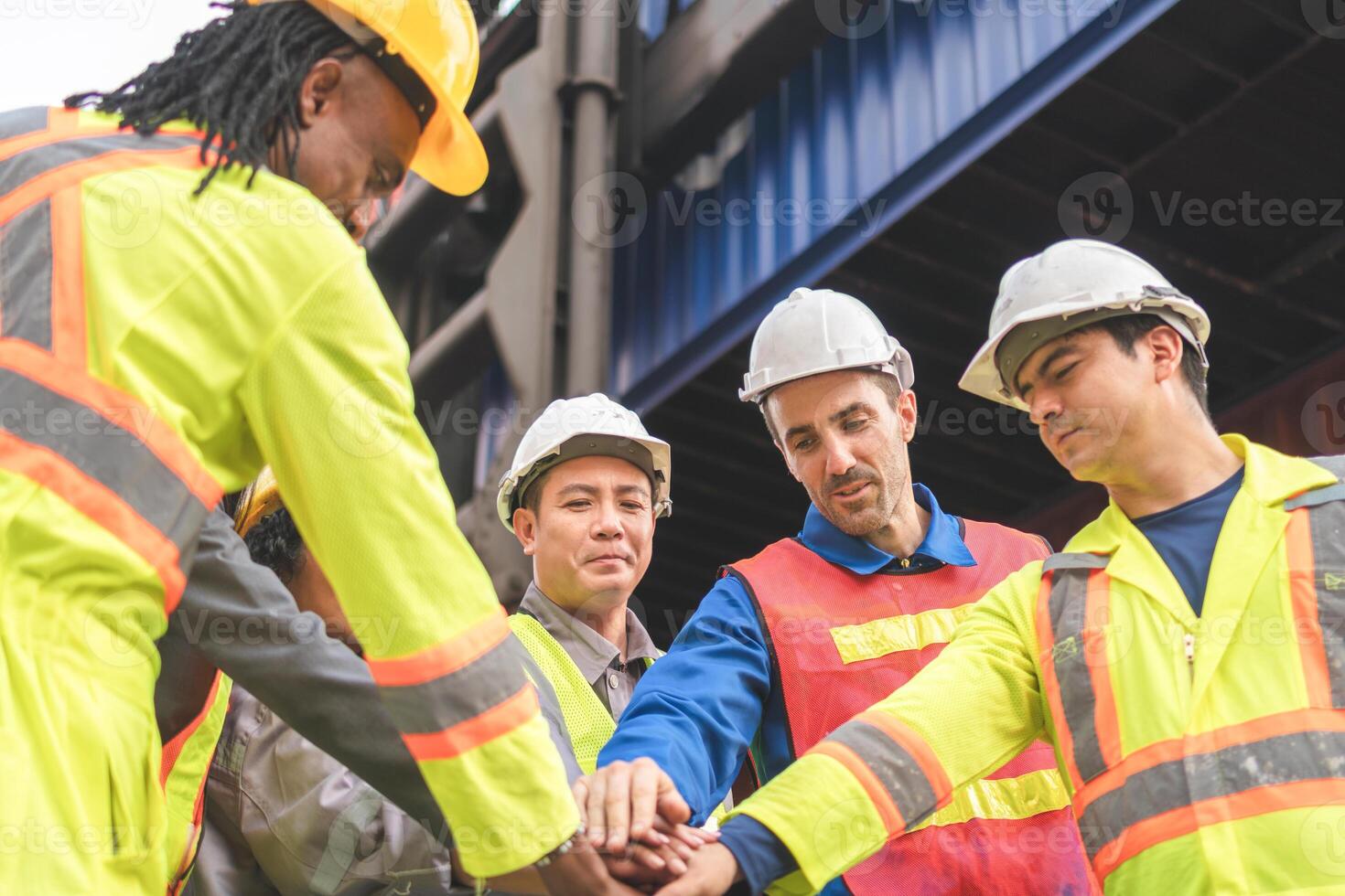 Diverse Team of Engineer and Workers Motivated and Excited, Industrial Team Celebrating Success at Shipping Container Yard photo