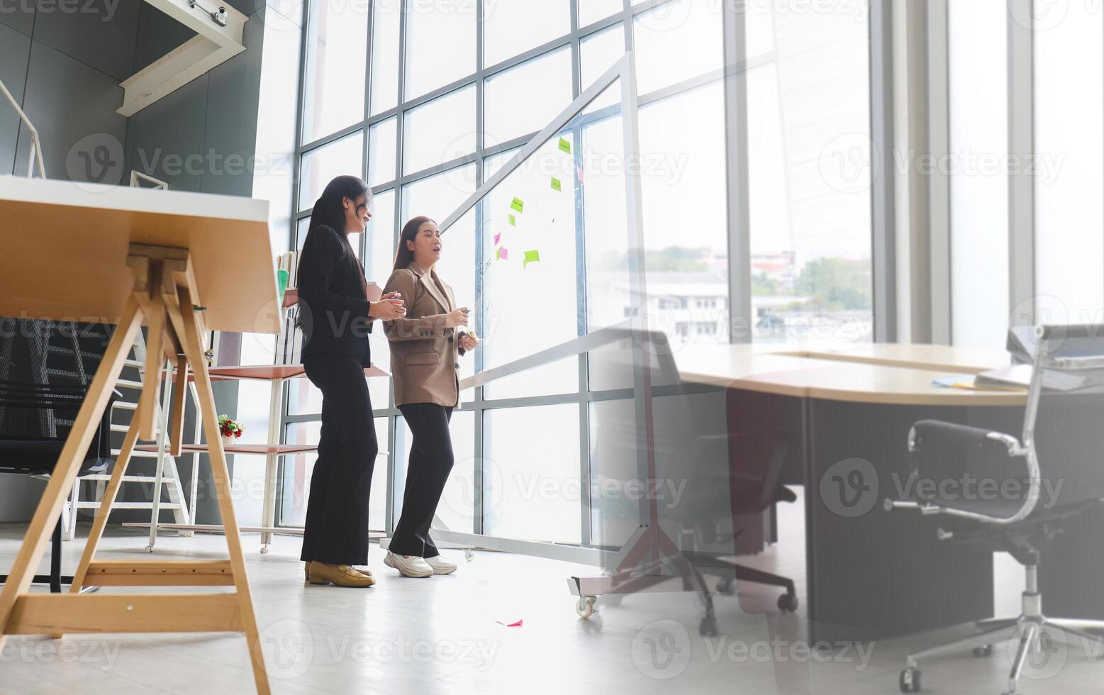 Teamwork and Brainstorming Concept with Businesswomen in Office Meeting, Creative Business Meeting with Women Discussing Ideas in Office Space photo