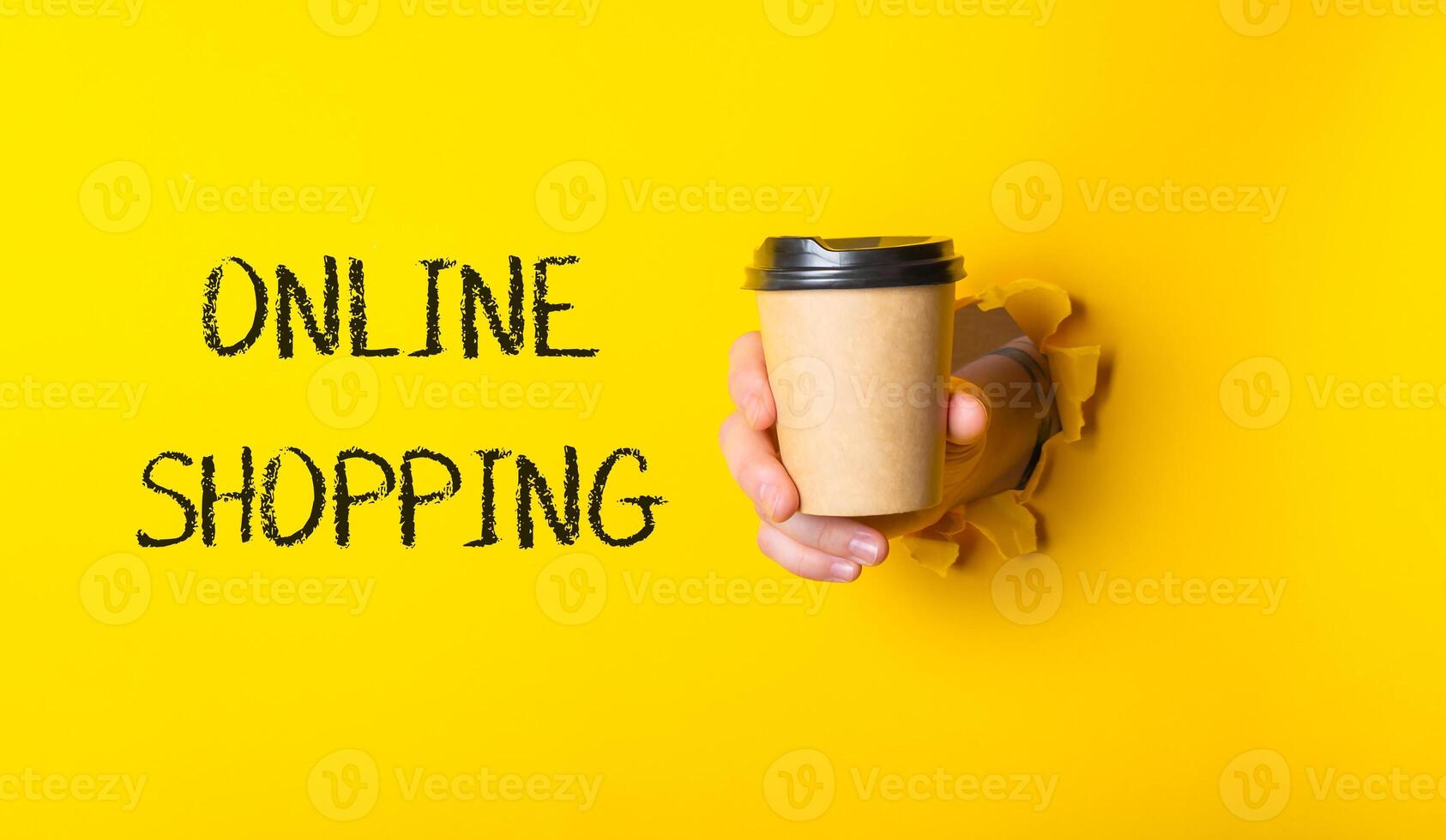 A person is holding a coffee cup photo