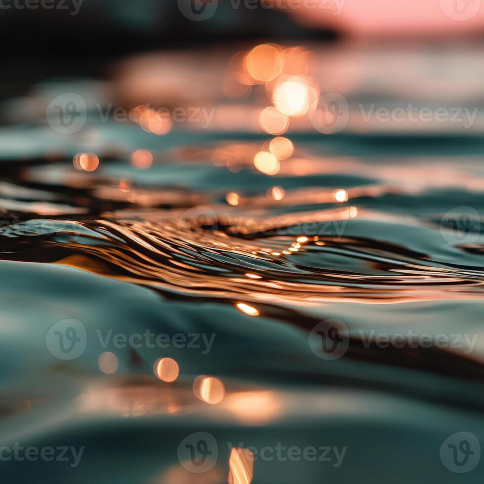 Rippling water reflects sunlight at evening twilight photo