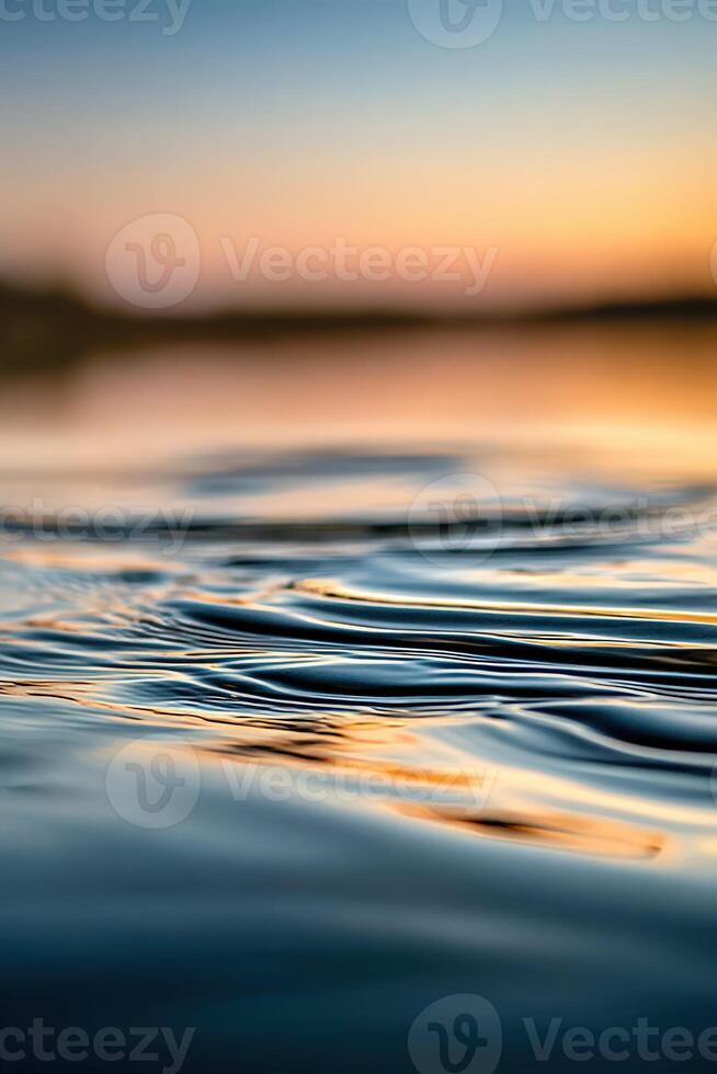 Serene water surface reflecting the evening sky photo