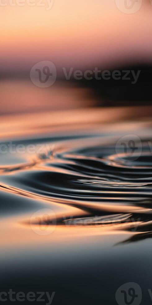 Rippling water reflects sunset colors in calm surroundings photo