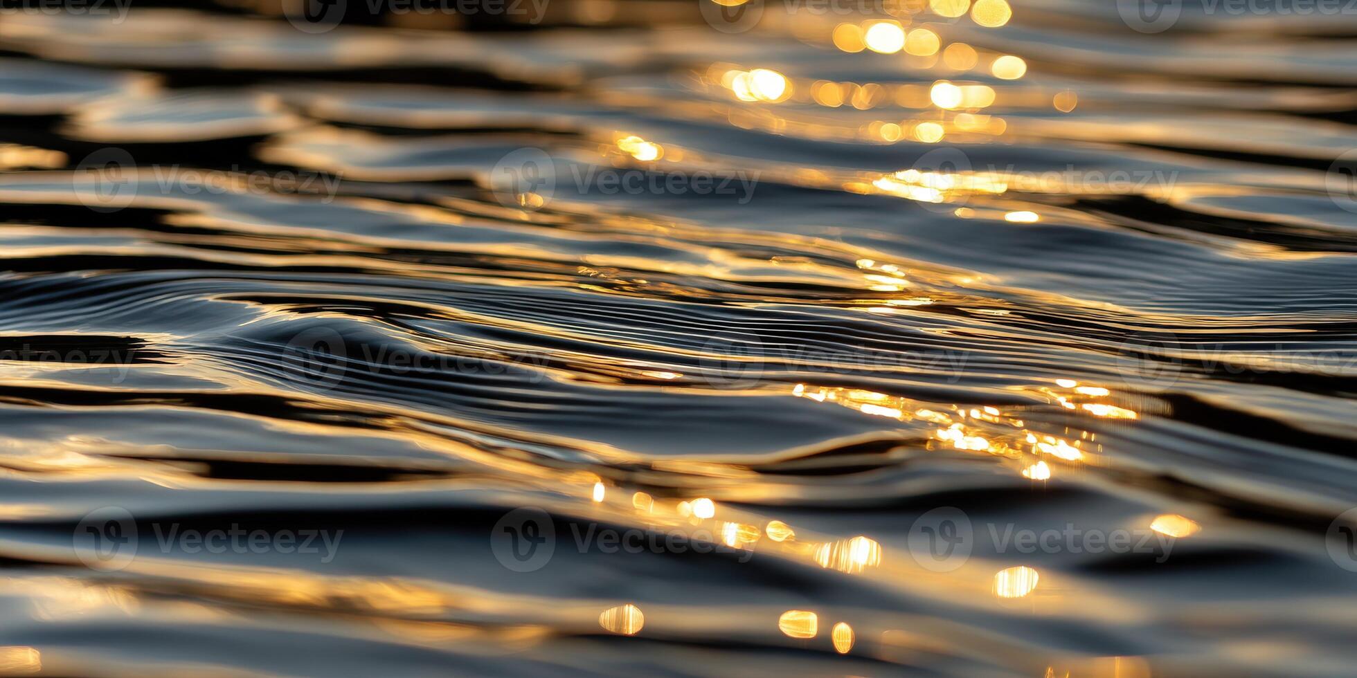 Reflections dance on water's surface at golden hour photo