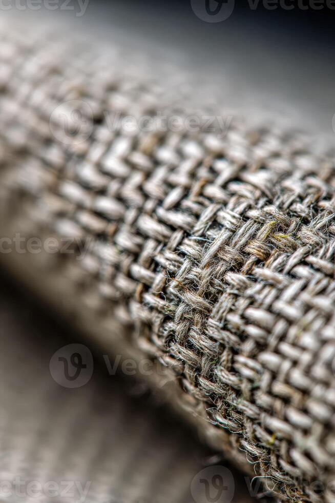 Close-up of textured fabric showcasing intricate woven pattern photo