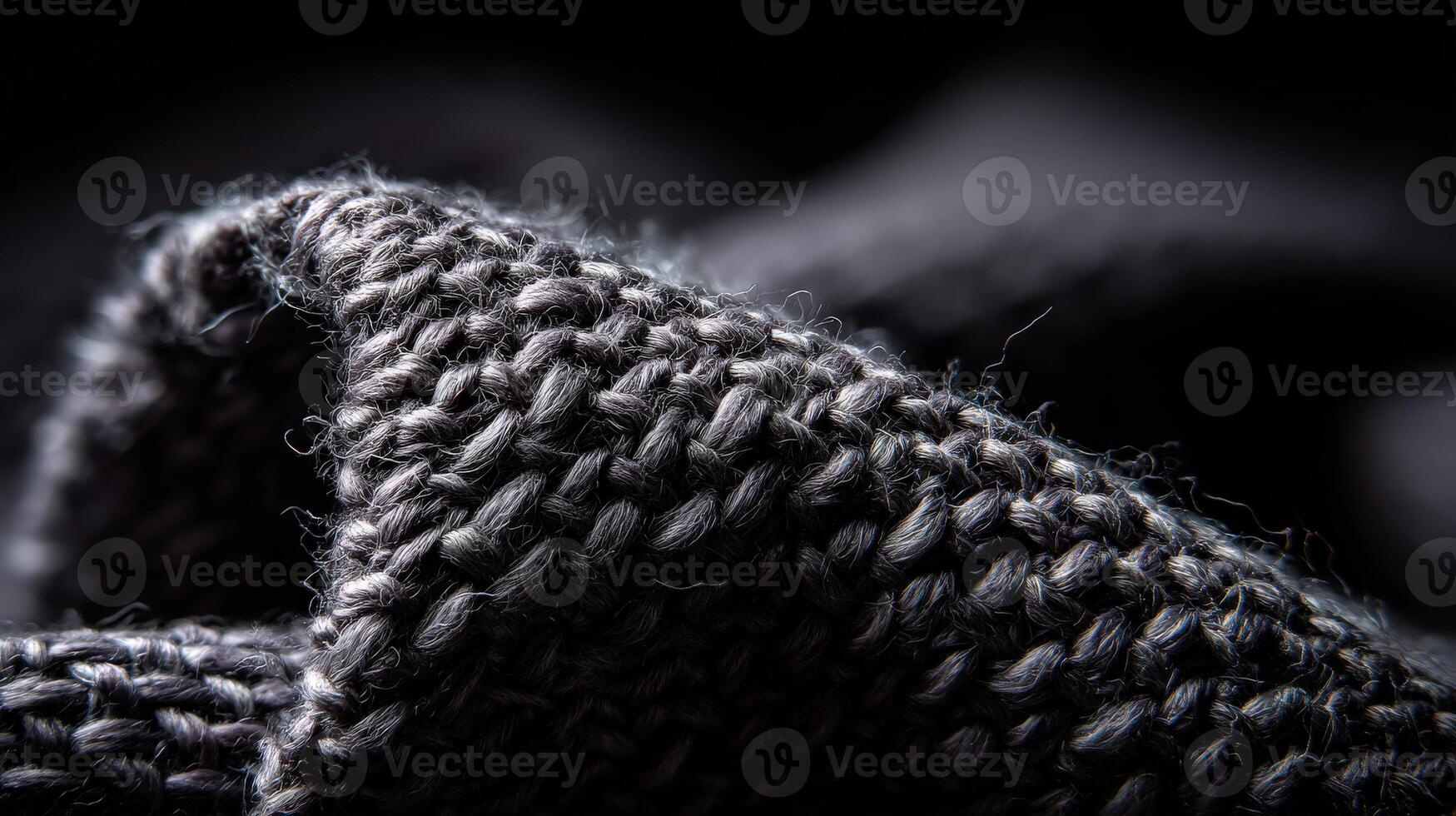 Detailed view of textured black fabric showcasing woven patterns photo