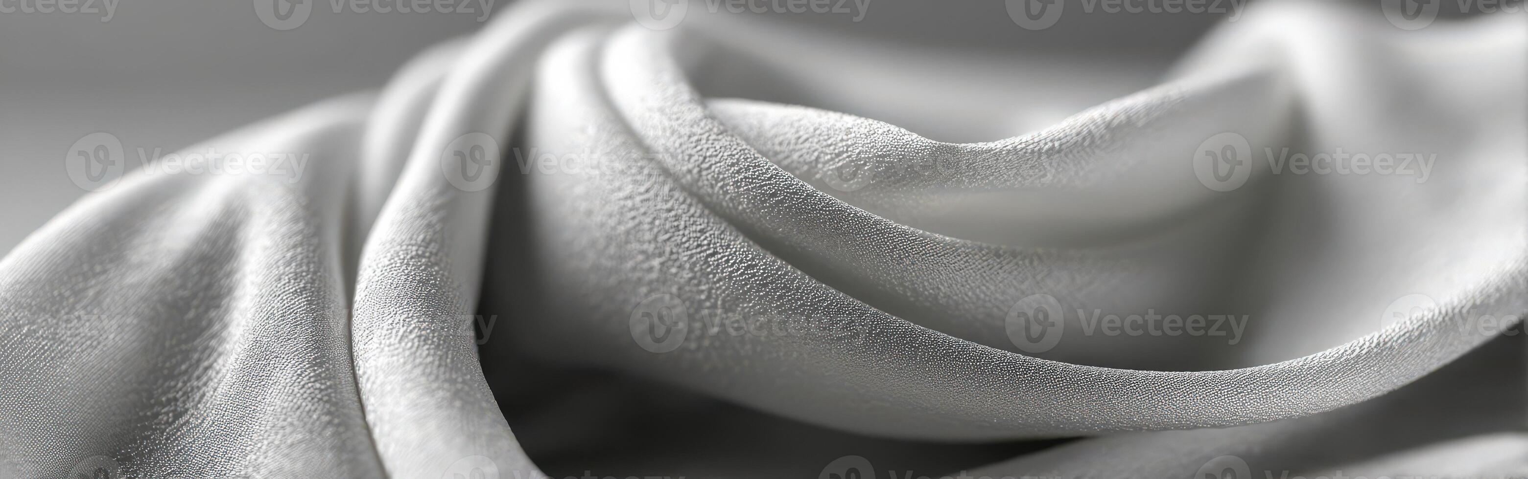 Textured white fabric draping elegantly under soft lighting photo