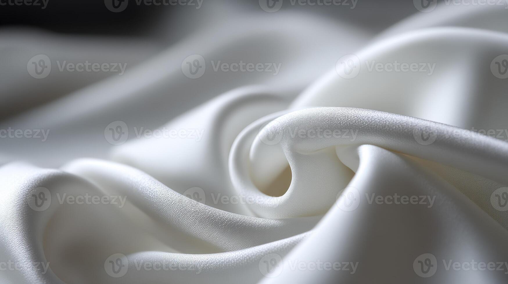 Soft and elegant white fabric draped in gentle curves and folds photo