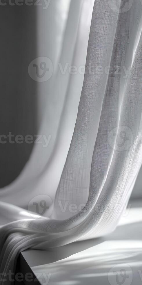 Fabric drapes softly against sunlight at home interior photo