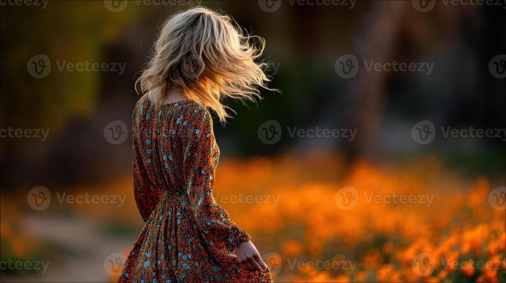 Woman in floral dress enjoying a sunny spring day photo
