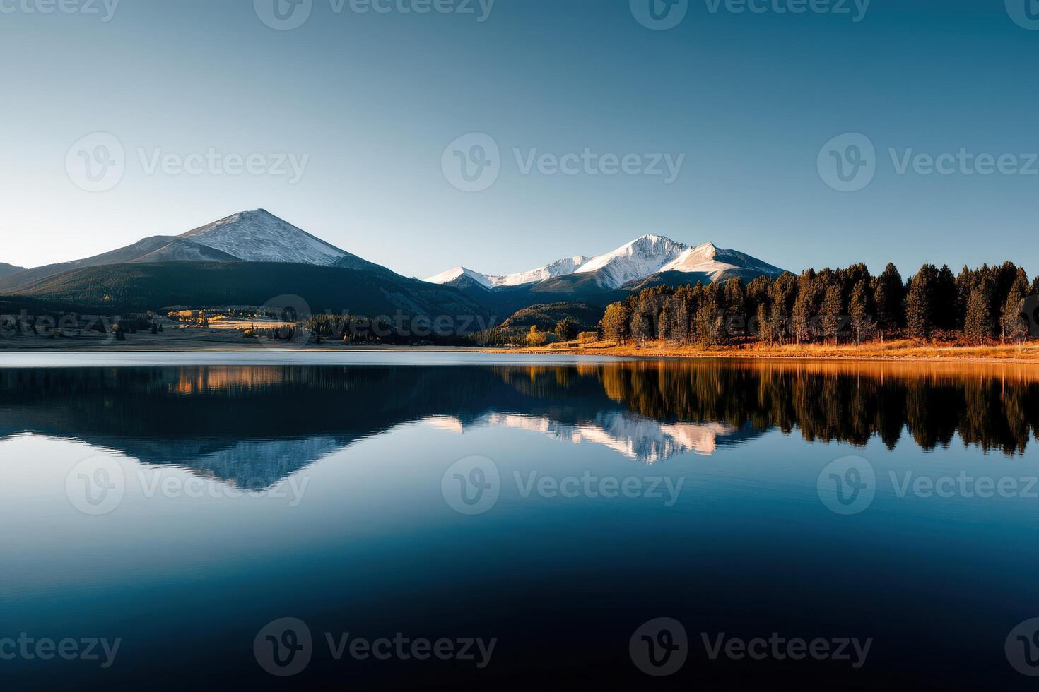 Serene reflections of mountains over calm lake water photo