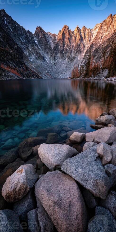 Lake reflecting mountains and trees photo