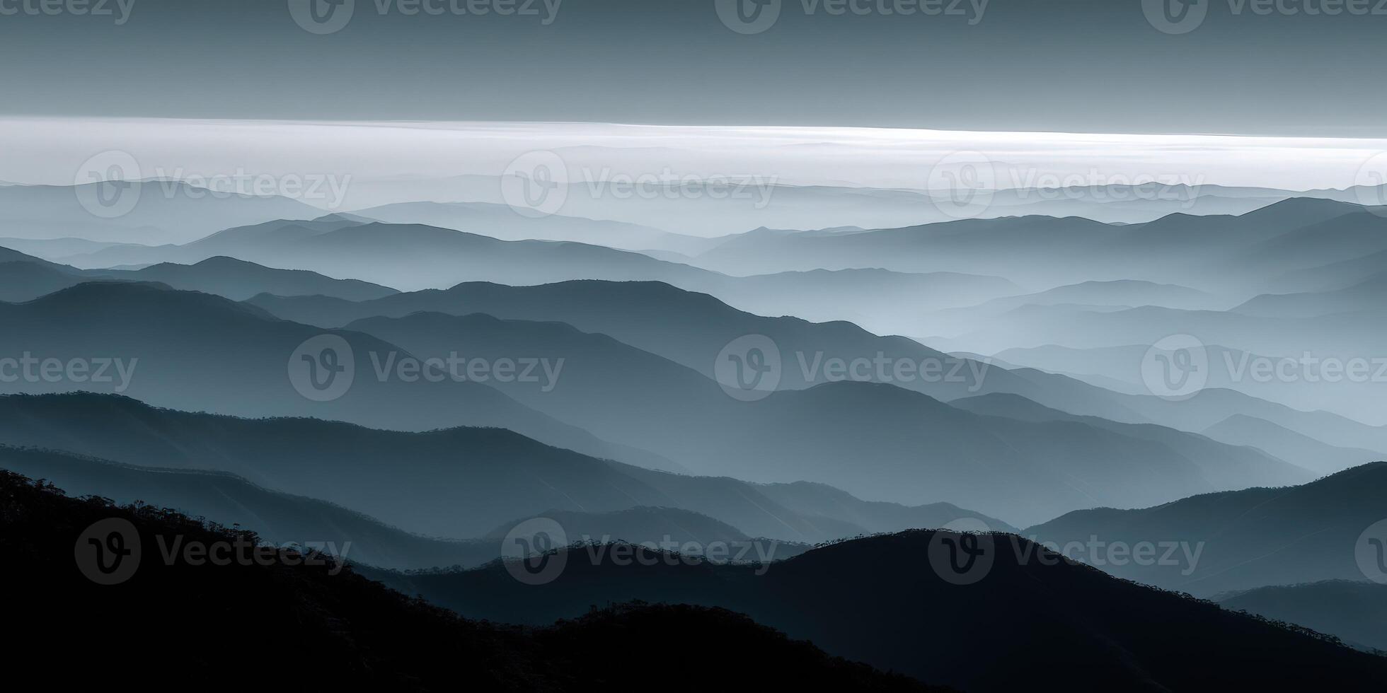 Misty mountain landscape with layered hills in twilight photo