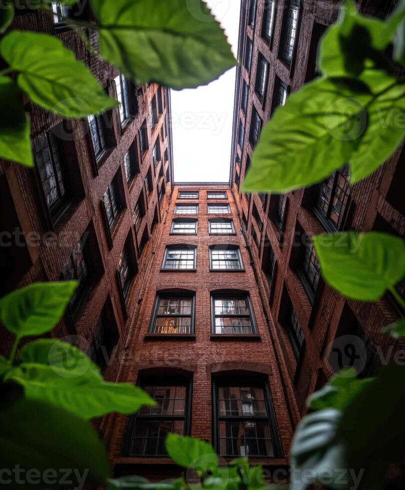 A view up at the top of a tall brick building photo