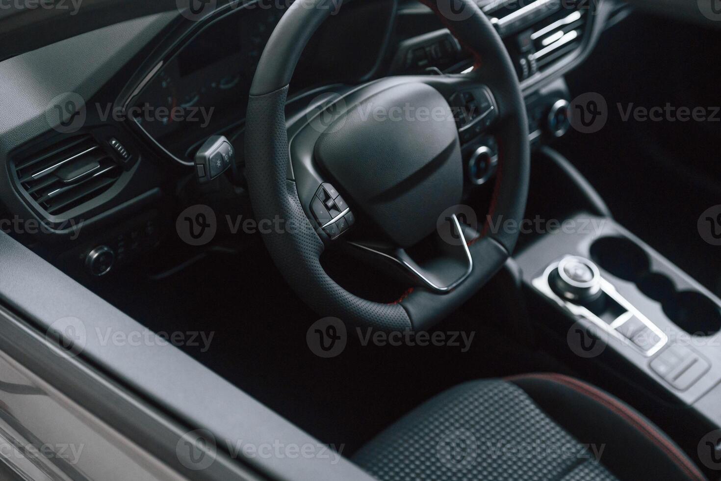 View of the steering, wheel and interior in modern car photo