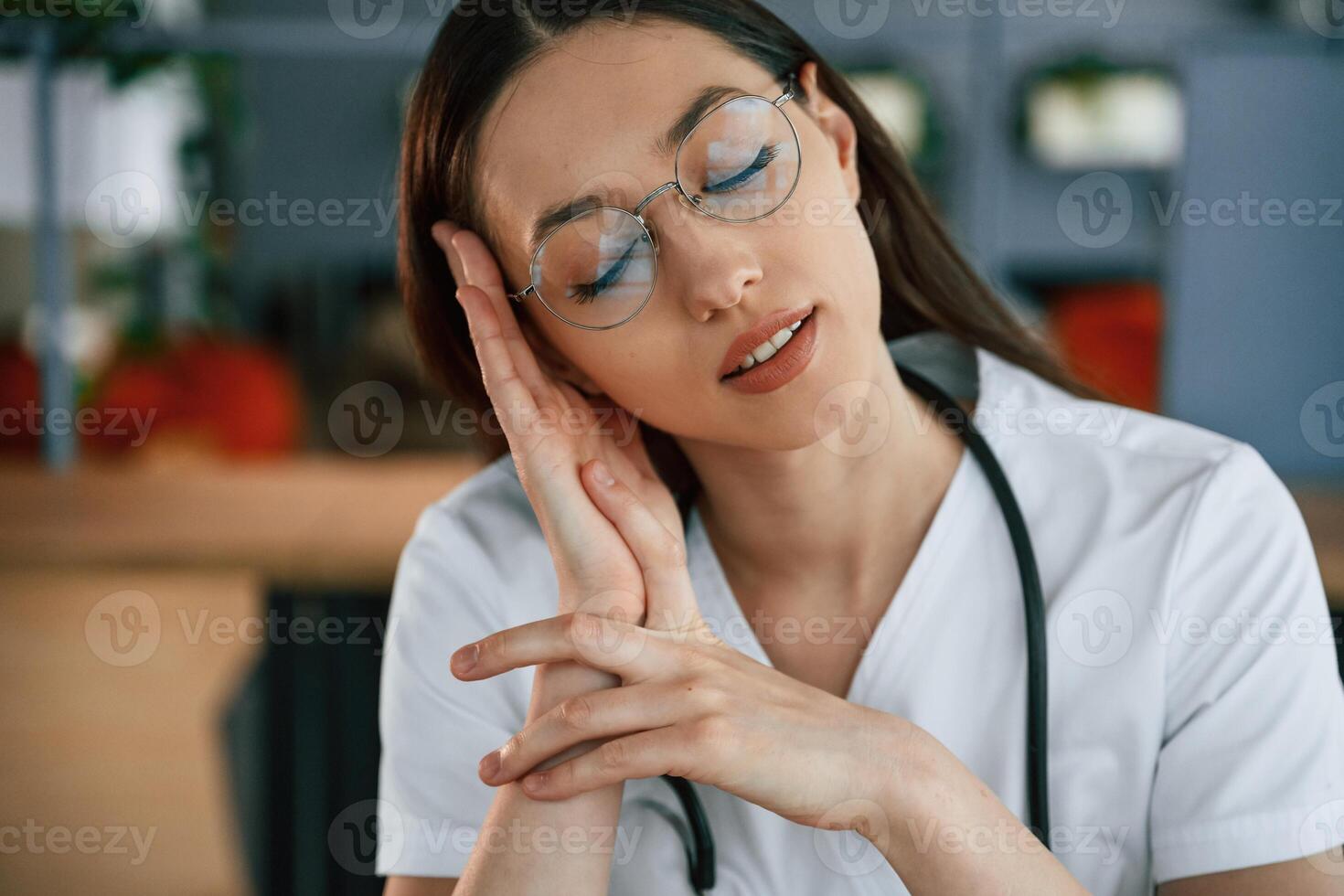 Portrait of ,female, doctor, in white coat is that is indoors photo