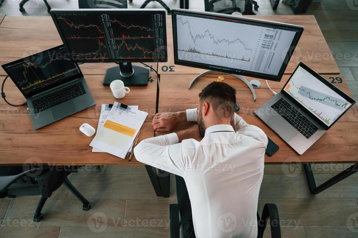 Tired, sleeping on, the, table. Businessman is sitting by computer and working in the, office photo
