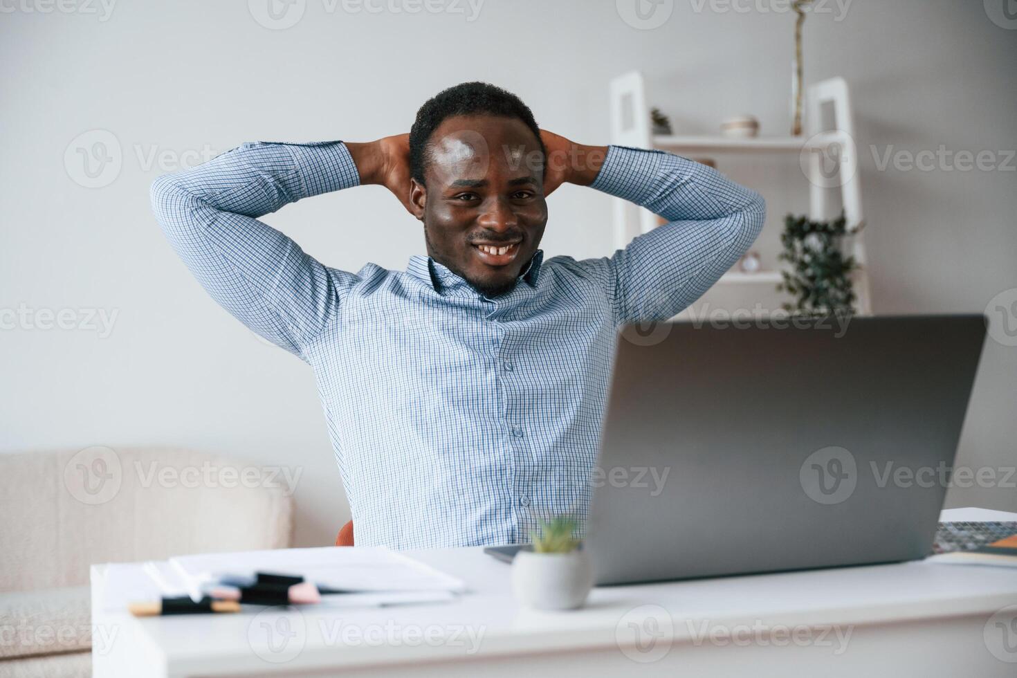 Front ,view. Businessman is working in the office by laptop photo