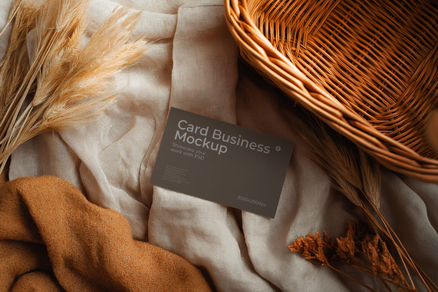 Business Card Mockup on Textured Fabric with Dried Flowers and Basket psd