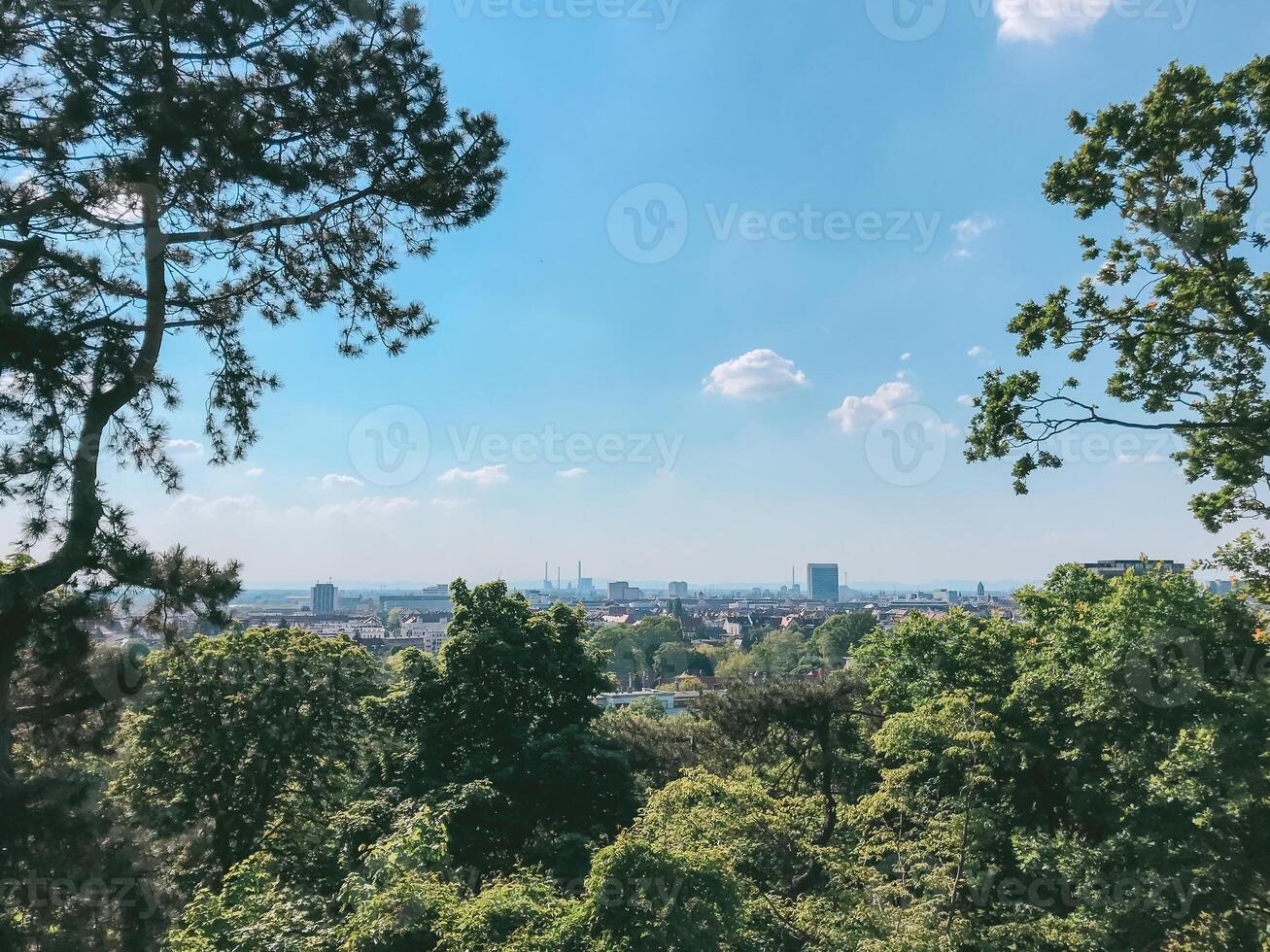 Beautiful view of a city with a blue sky and trees in the background photo