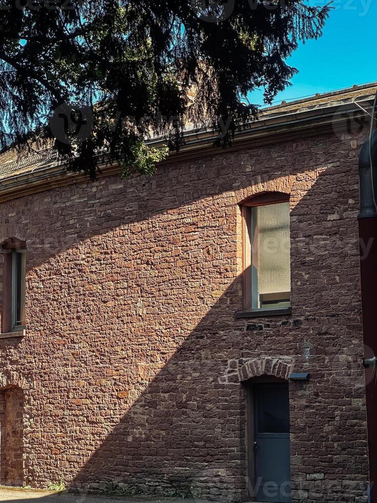 Brick building with a window and a door photo