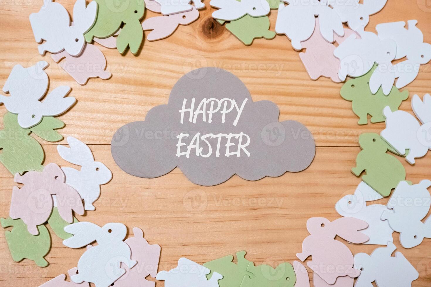 Wooden frame with a cloud and a bunch of Easter rabbits photo