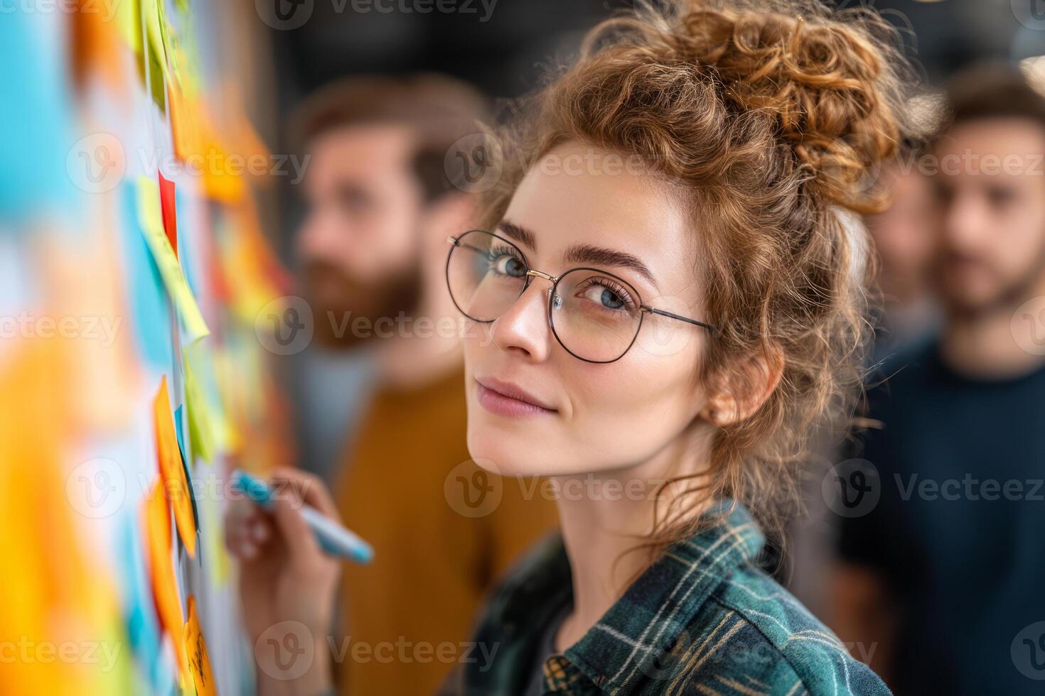 Young businesswoman planning strategy on colorful sticky notes photo