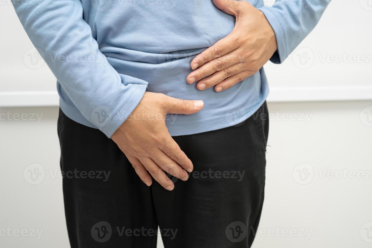 Hernia, Asian man stomach ache photo