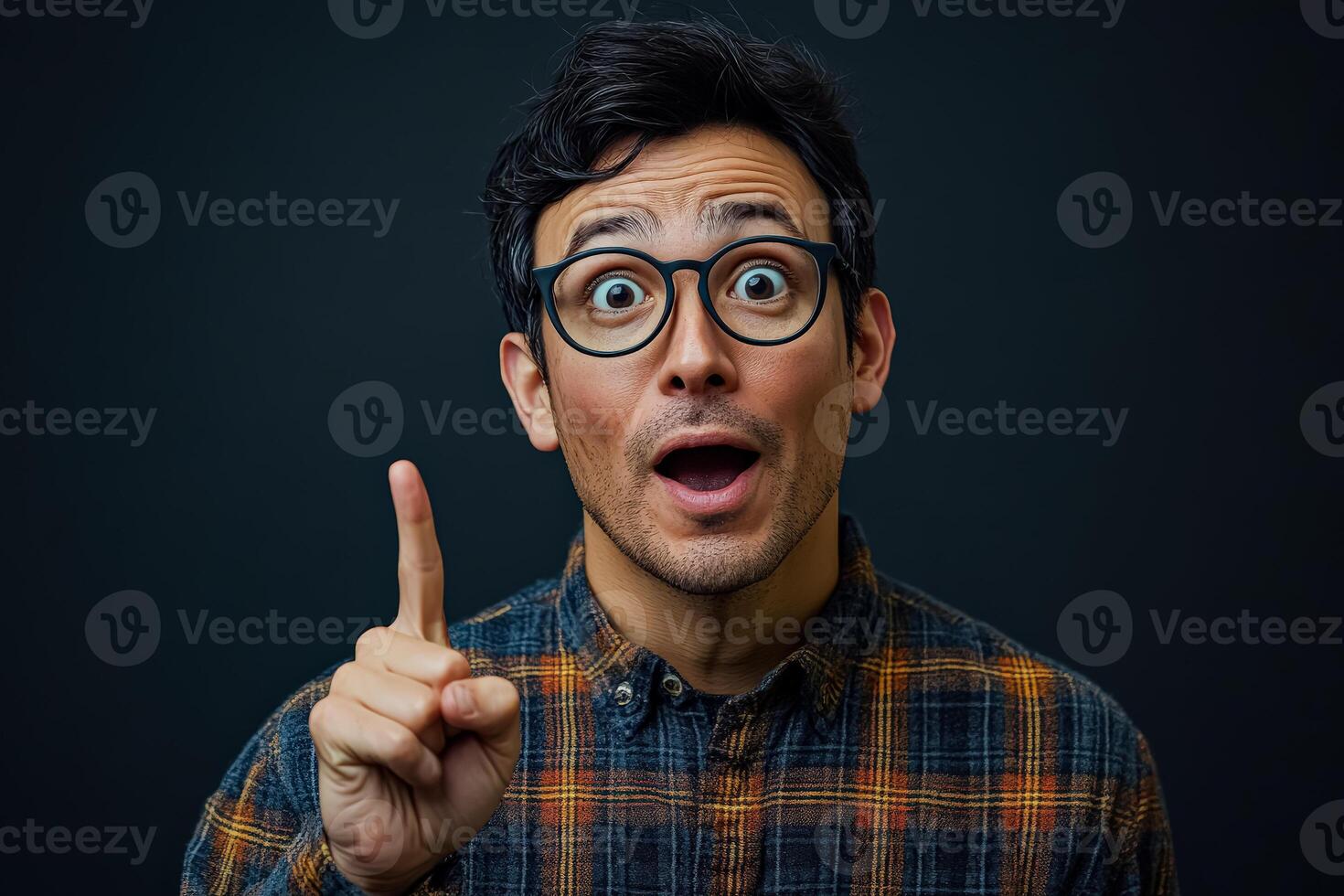 Man with glasses is pointing at something with his finger photo