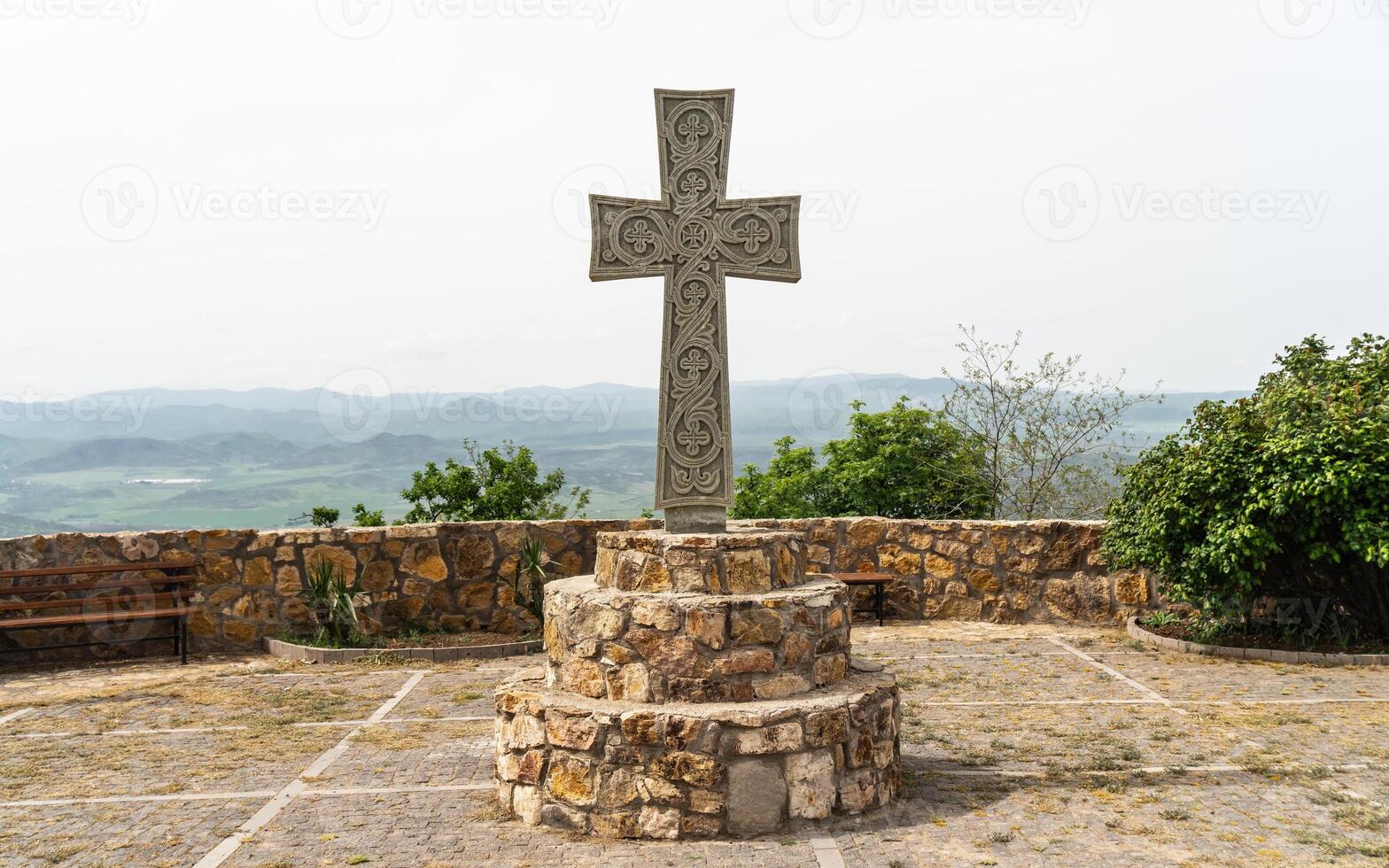 A Christian cross on the territory of Saint Peter and Paul monastery. Saint Peter and Paul monastery in Bolnisi Municipality of Kvemo Kartli region of Georgia photo