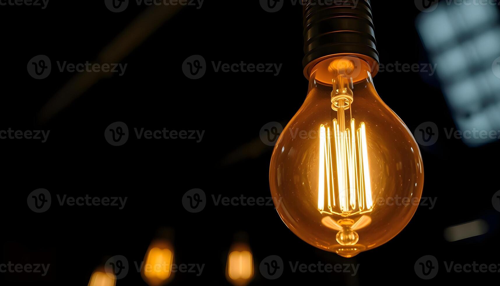 A close up of a light bulb in a dark room photo