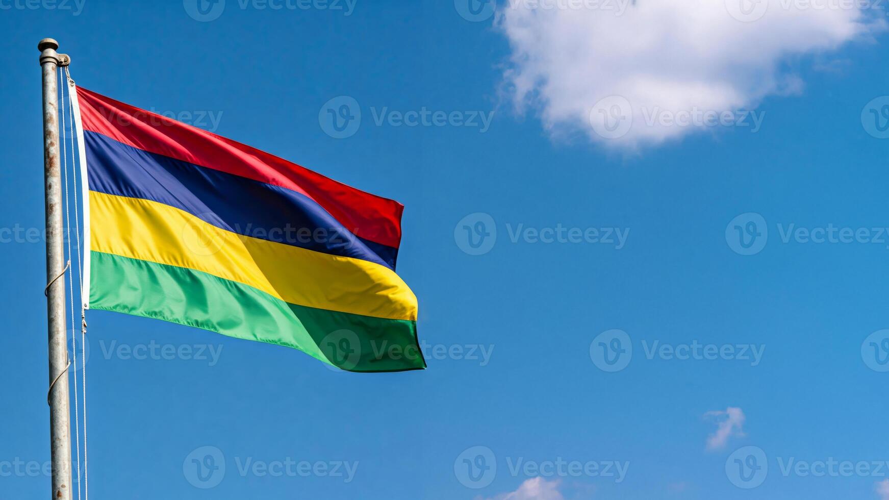 National flag of mauritius waving on blue cloudly sky photo