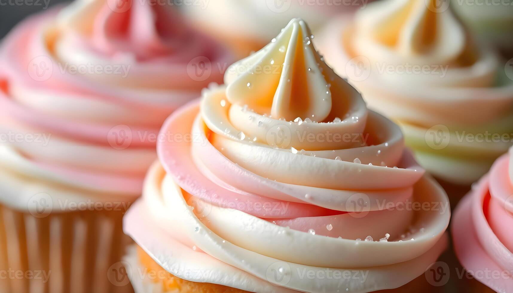 a close up of a cupcake with pink and white frosting photo