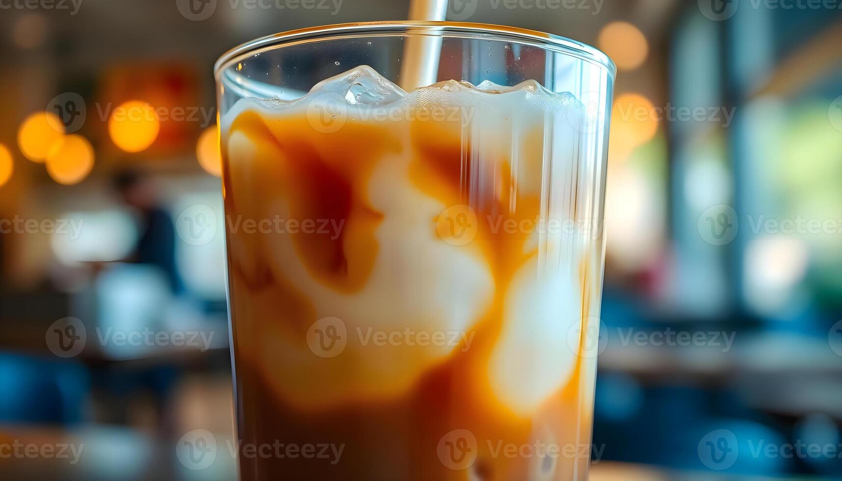 An iced coffee with a straw in it photo