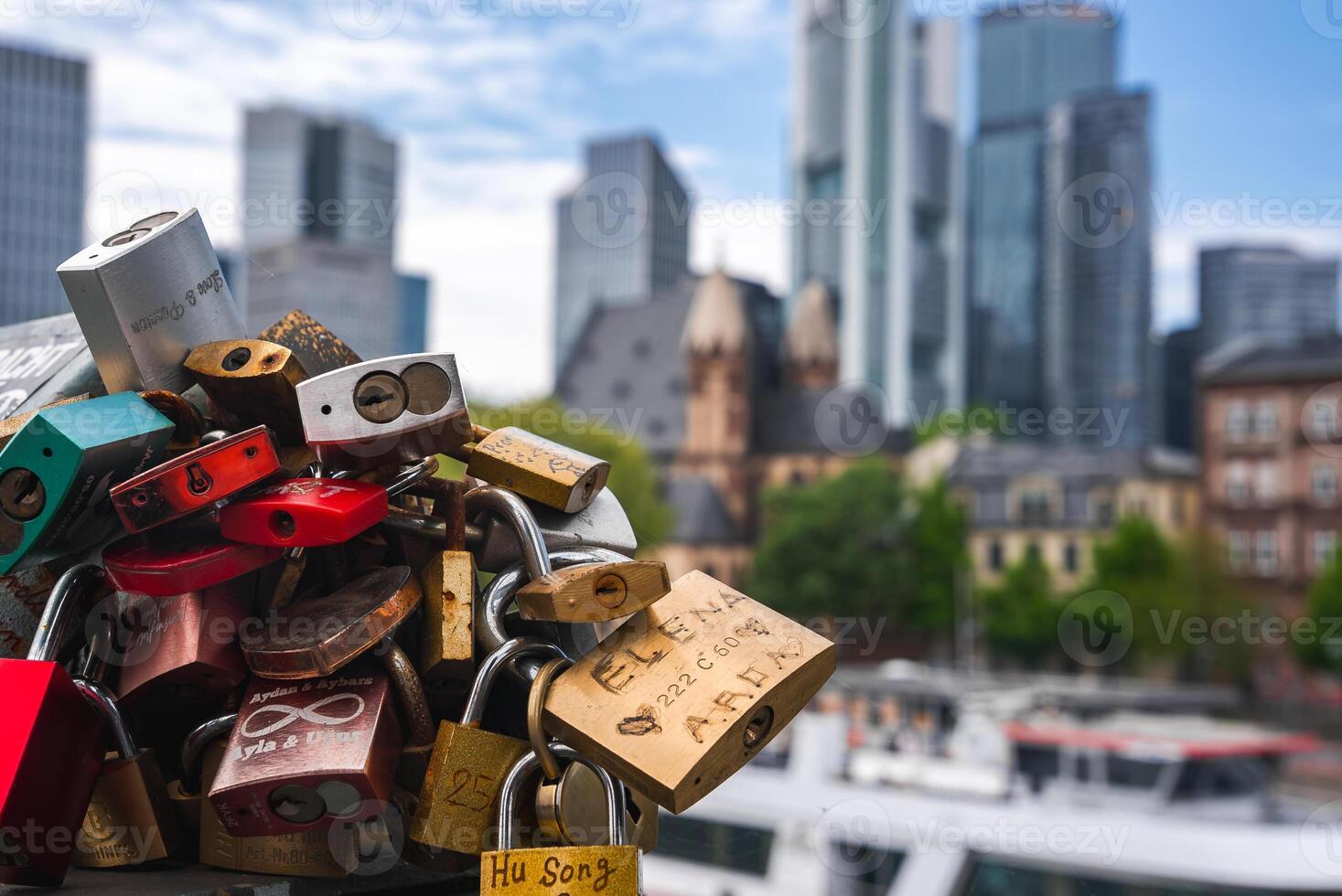 Love Locks and Frankfurt Skyline with Historic and Modern Landmarks photo